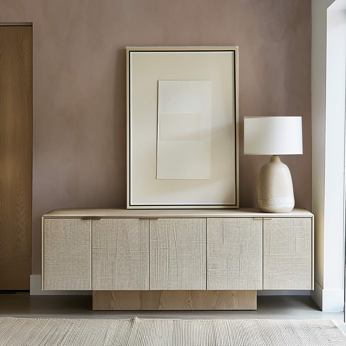 A living room scene with a beige sofa, wooden floor, and green walls, featuring a wooden block brush in front of a window.