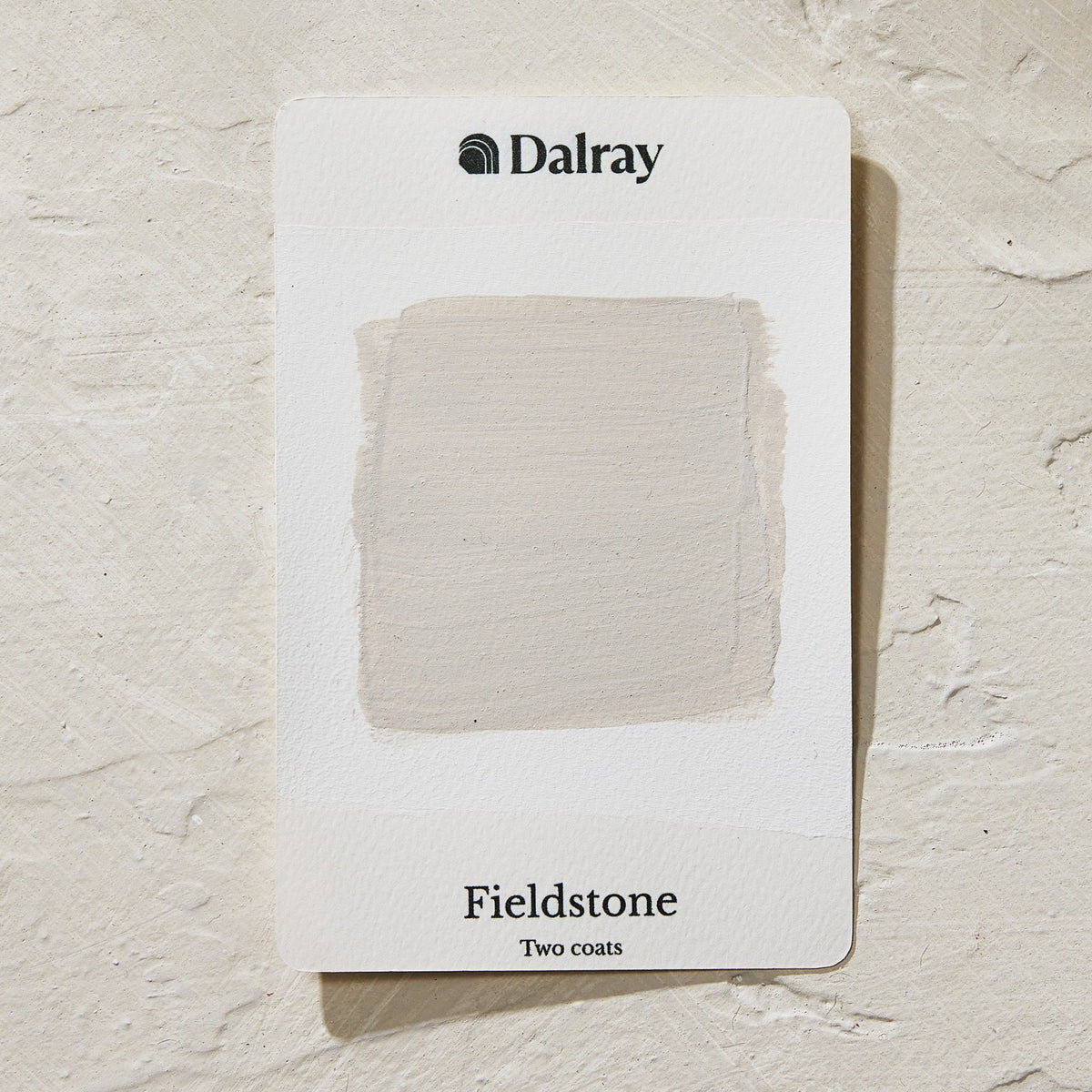A Dalray paint color card showing the 'Fieldstone' finish with two limewash australia coats applied, displayed on a textured off-white background.